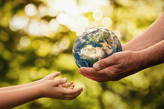 Advocates are asking lawmakers to honor Earth Day by supporting a bill to require oil and gas companies to contribute to a fund to fight climate change. (Rangizz/Adobe Stock)